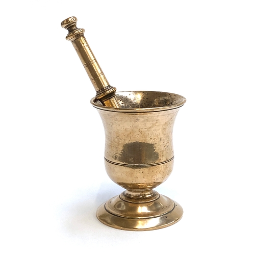 311 - An 18th century brass pestle and mortar, 12cmH