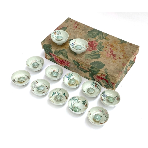 230 - A set of twelve early 20th century Japanese porcelain novelty sake cups, each with moving turtle, 3.... 