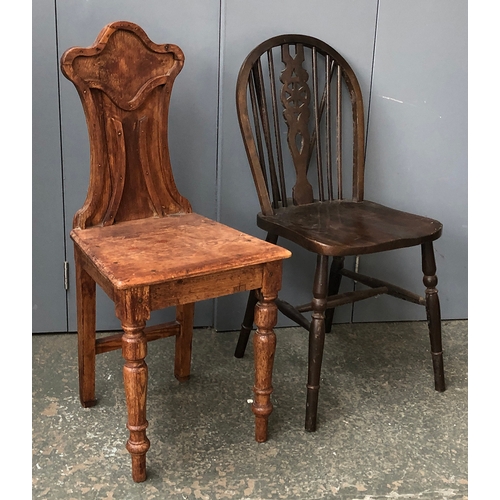 726 - An unusual pine hall chair; together with a wheelback kitchen chair (2)