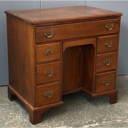 730 - A small 20th century kneehole secretaire desk in 18th century style, the sliding drawer revealing a ... 