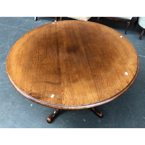 774 - A circular oak table by Titchmarsh & Goodwin, on balsuter column and cabriole pad feet, bears plaque... 