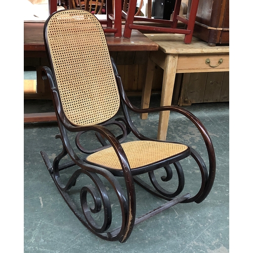 835 - A bentwood Thonet style caned rocking chair