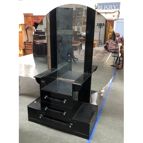 845 - An Art Deco black painted oak dressing stand, with three part circular mirror, above a stepped base ... 