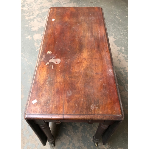 900 - A 19th century mahogany rectangular drop leaf table, on turned tapering legs and casters, 52x112x73c... 