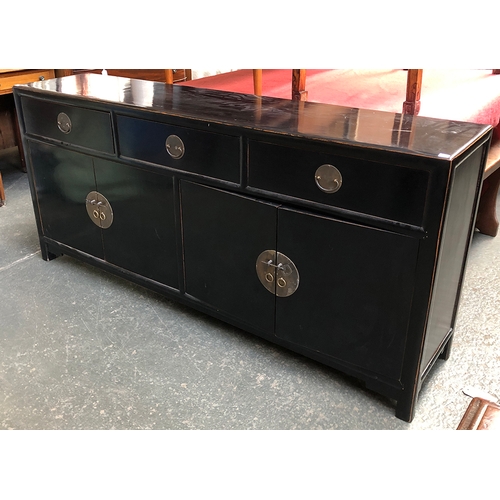 829 - Interior design interest: a black lacquer sideboard of three short over four cupboard doors, 175x40x... 