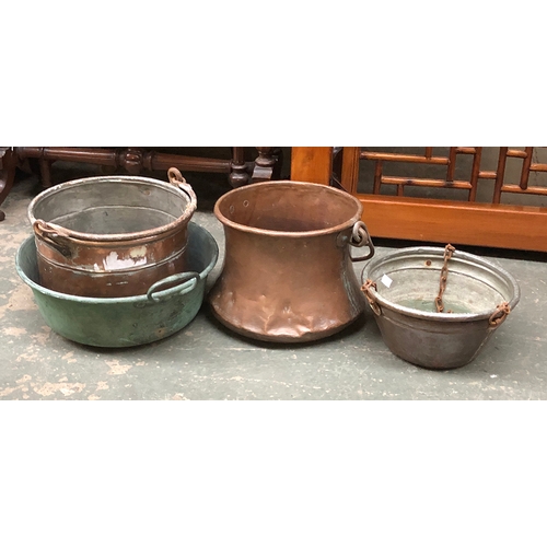 918 - A French copper pot with wrought iron loop handle, 30cmD; together with three other copper pots