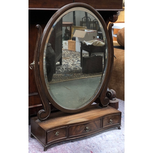 838 - A 20th century oval adjustable box mirror mirror with bevelled glass over three serpentine drawers, ... 