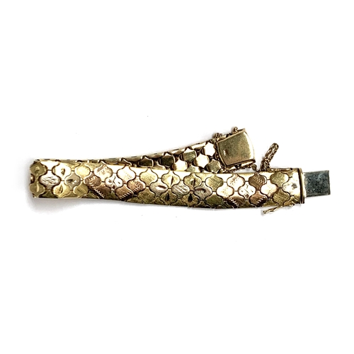 39 - A heavy 14ct gold three tone bracelet, 1.3cm wide, 36.6g