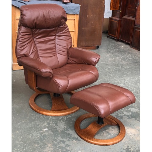 722 - A 20th century Swedish Anderssons 20th reclining leather swivel chair with foot stool, bears label