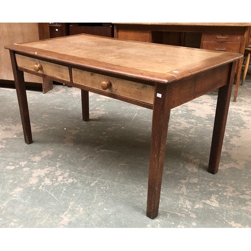 909 - An oak desk or writing table with two pine drawers, square tapered legs, 137x75x76cmH