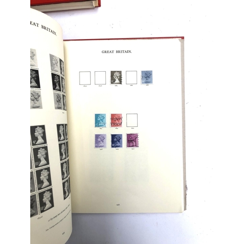 409 - A quantity of British definitive stamps in three red Windsor albums, 1971 onwards, to include region... 