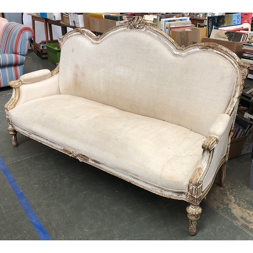 982 - A 20th century carved gilt gesso sofa, with ribbon cresting, in need of reupholstry, 181cmW