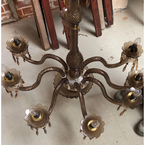 987 - An eight arm smoked glass chandelier, approx. 82cmD