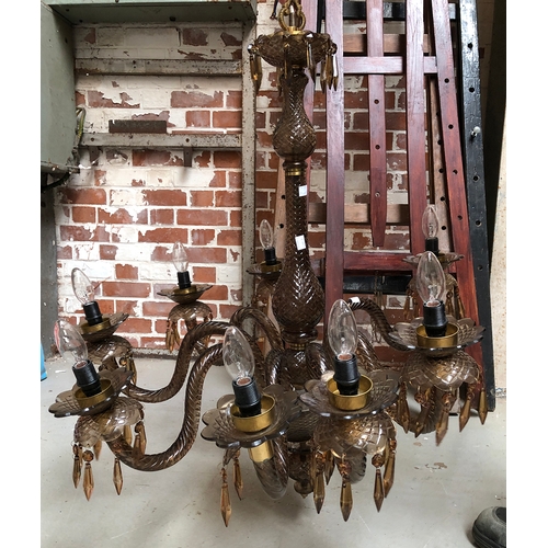 987 - An eight arm smoked glass chandelier, approx. 82cmD