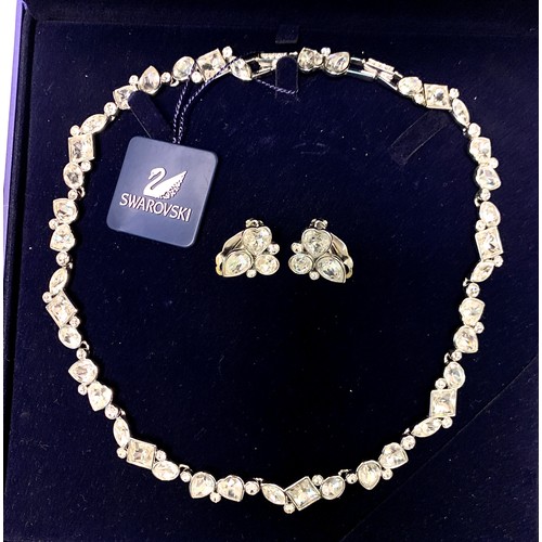 49A - A boxed Swarovski 'Dream' necklace, model no. 851812, with matching clip-on earrings