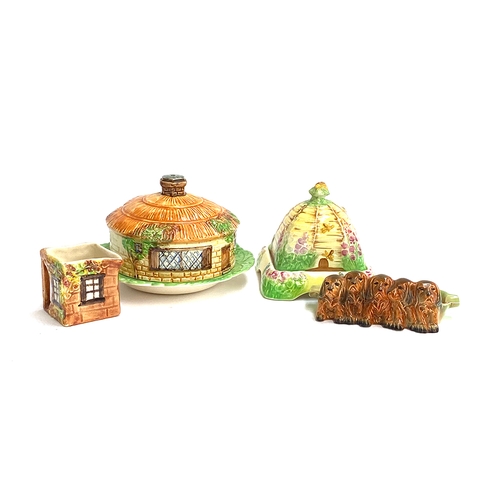 127 - A Beswick cottage cloche; a Royal Winton Grimwades beehive (af); Beswick dogs etc