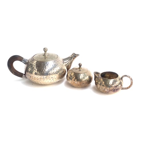 109 - An Arts & Crafts style three piece plated teaset with planished finish