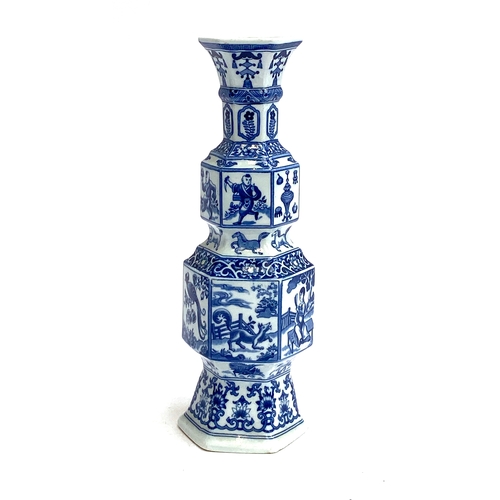 130 - A Chinese style blue and white hexagonal form vase with flared rim, 31cmH