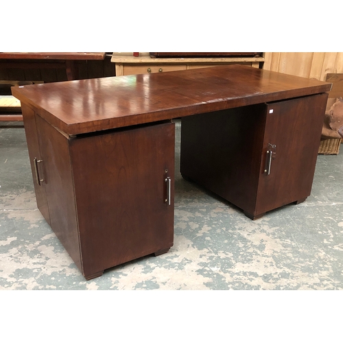 670 - A 20th century Iroko pedestal desk, each pedestal with cupboard door opening to four slides, the out... 