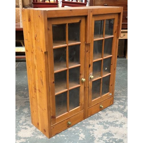 679 - A glazed pine cabinet with two doors and shelves, 100cmW