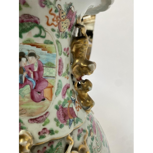 138 - A 19th century Chinese famille rose baluster vase (af), painted with court scenes, with twin foo dog... 