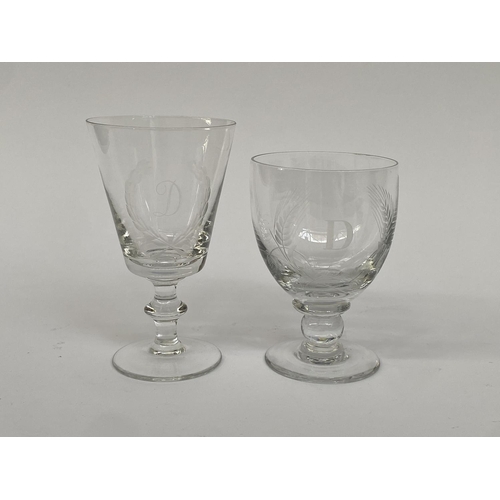 140 - Two hand blown wine glasses, each engraved with the letter 'D', 14.5cmH and 17cmH (2)