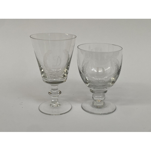 140 - Two hand blown wine glasses, each engraved with the letter 'D', 14.5cmH and 17cmH (2)