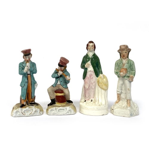 148 - Five small ceramic figurines, to include a Staffordshire spill vase, 12.5cmH