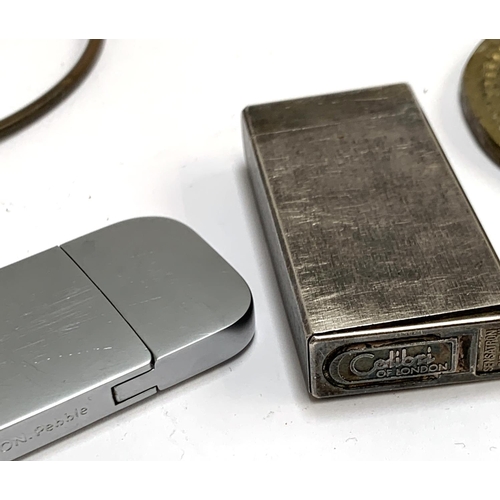 256 - A Colibri Sensation lighter, together with a Lexon Pebble lighter, novelty metal keys etc