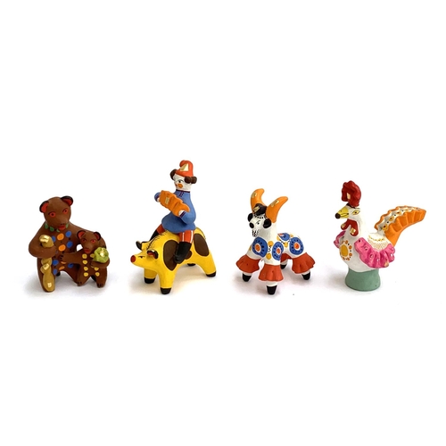 162 - Four Russian Dymkovo folk art pottery figurines, cockerel, bull, two bears, and a boy with an accord... 