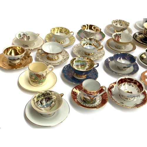 167 - A large collection of approx. 42 mainly German souvenir coffee cups and saucers to include Johann Fe... 