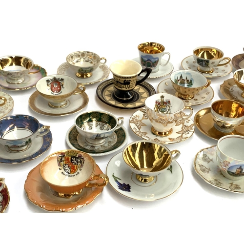 167 - A large collection of approx. 42 mainly German souvenir coffee cups and saucers to include Johann Fe... 