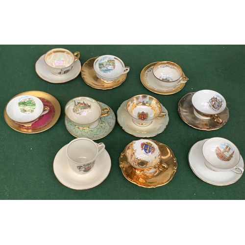 167 - A large collection of approx. 42 mainly German souvenir coffee cups and saucers to include Johann Fe... 