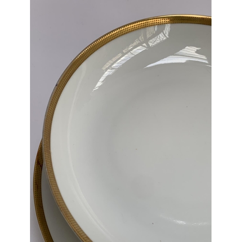 173 - A quantity of smart Heutschenreuther, KPM, Rosenthal and Arzberg porcelain dinnerware with gilt rim ... 