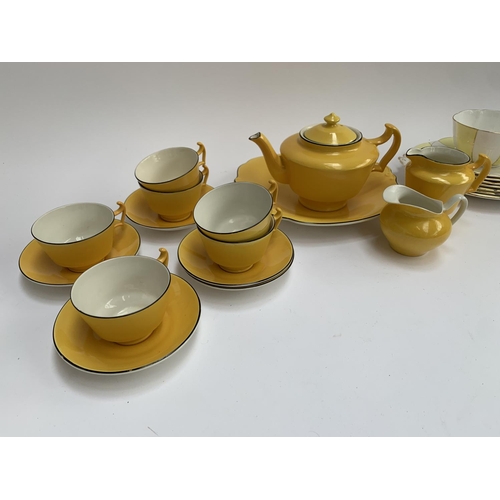 183 - A Royal Albert yellow and white striped part tea service together with a further yellow part tea ser... 