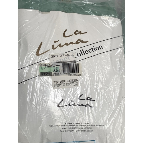 616 - A quantity of sealed green satin La Lima curtains, pelmets and ties