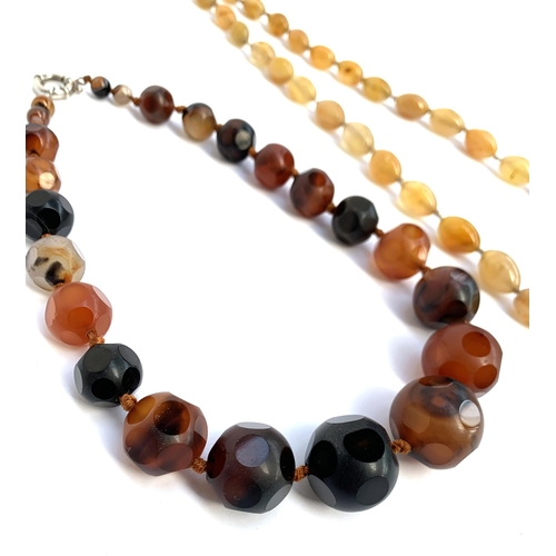 2 - A graduated agate bead necklace with polished polka dot facets, the beads graduating from 0.8cmD to ... 