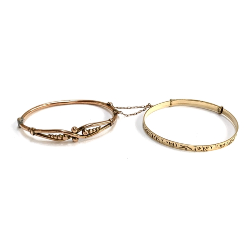 18 - A 9ct gold child's bangle, solder repair to hinge, 6cmW, 4.7g; together with a 1/5th 9ct gold bronze... 