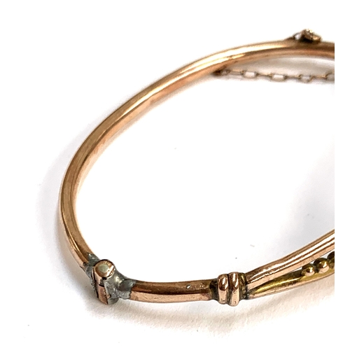 18 - A 9ct gold child's bangle, solder repair to hinge, 6cmW, 4.7g; together with a 1/5th 9ct gold bronze... 