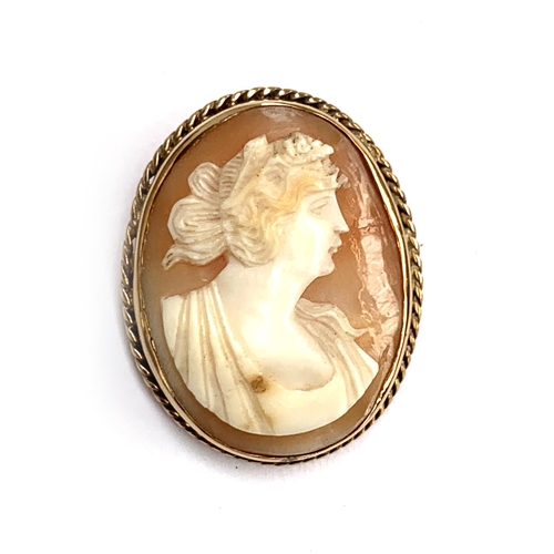 20 - A yellow metal mounted shell cameo brooch, unhallmarked but tests as 9ct, 3.3cmL, 8.4g gross weight