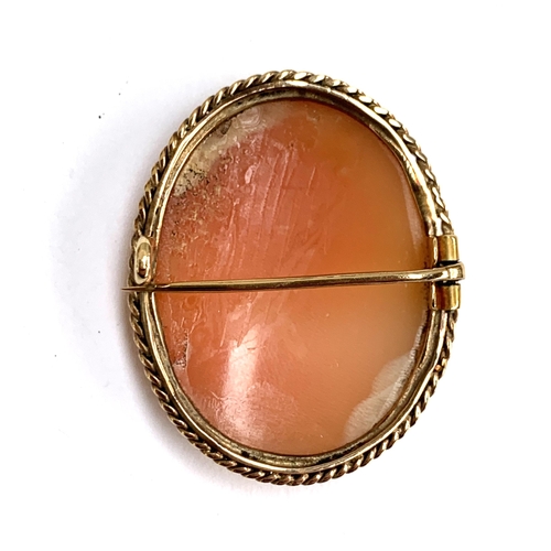 20 - A yellow metal mounted shell cameo brooch, unhallmarked but tests as 9ct, 3.3cmL, 8.4g gross weight