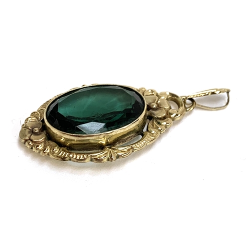 24 - A German Jugendstil 8ct gold and green paste pendant, 5.5cmL including bail. 9.7g