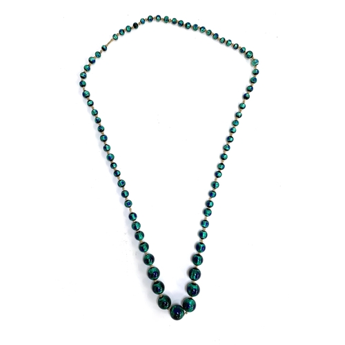 29 - A Czech Art Deco foiled peacock glass bead necklace, the largest bead 1.7cm, 42cmL