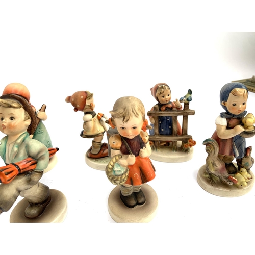 216 - A quantity Goebel Hummel figurines to include 'Be Patient', 'To Market', 'Happy Traveller', 'Little ... 