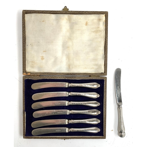 108 - A cased set of six silver handled butter knives, hallmarked for Sheffield, JB, 1924; with one other