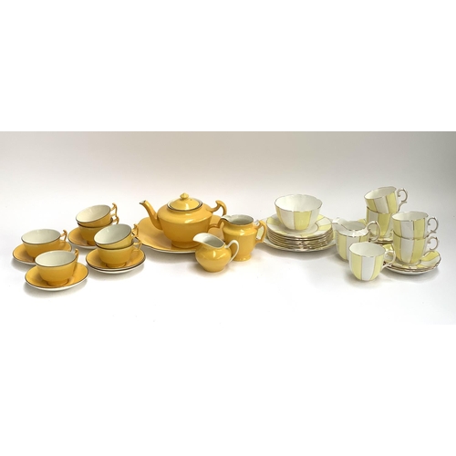 183 - A Royal Albert yellow and white striped part tea service together with a further yellow part tea ser... 