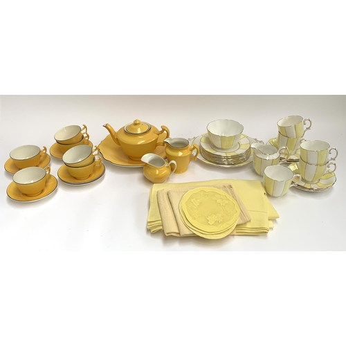 183 - A Royal Albert yellow and white striped part tea service together with a further yellow part tea ser... 