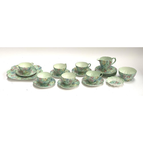 186 - A Shelley 'Melody' tea set, comprising six teacups, saucers and cake plates, sandwich plate, butter ... 