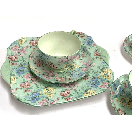 186 - A Shelley 'Melody' tea set, comprising six teacups, saucers and cake plates, sandwich plate, butter ... 