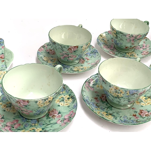 186 - A Shelley 'Melody' tea set, comprising six teacups, saucers and cake plates, sandwich plate, butter ... 